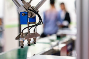 Close-up of an automated robotic pick-and-place arm